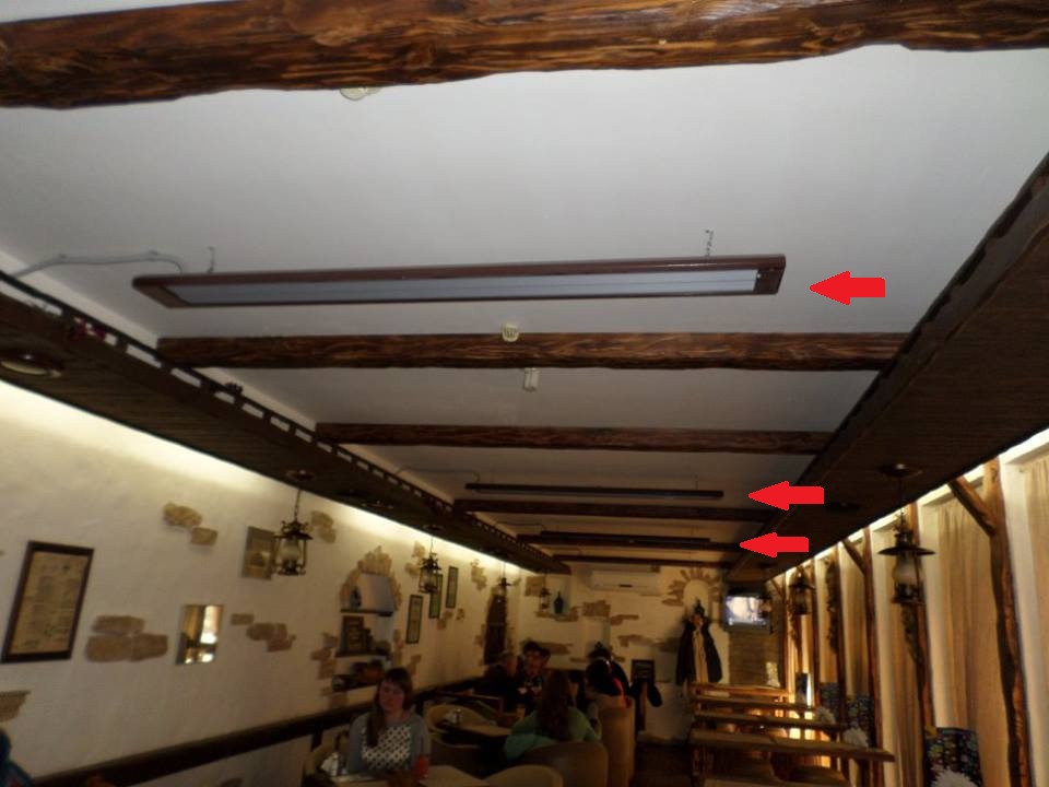 Teplov heaters in a dark wood shade inside the Shkvarochka restaurant
